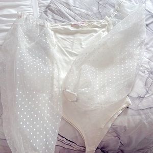 Brand is Jealous Tomato in a size small, it is a white body suit with mesh arms